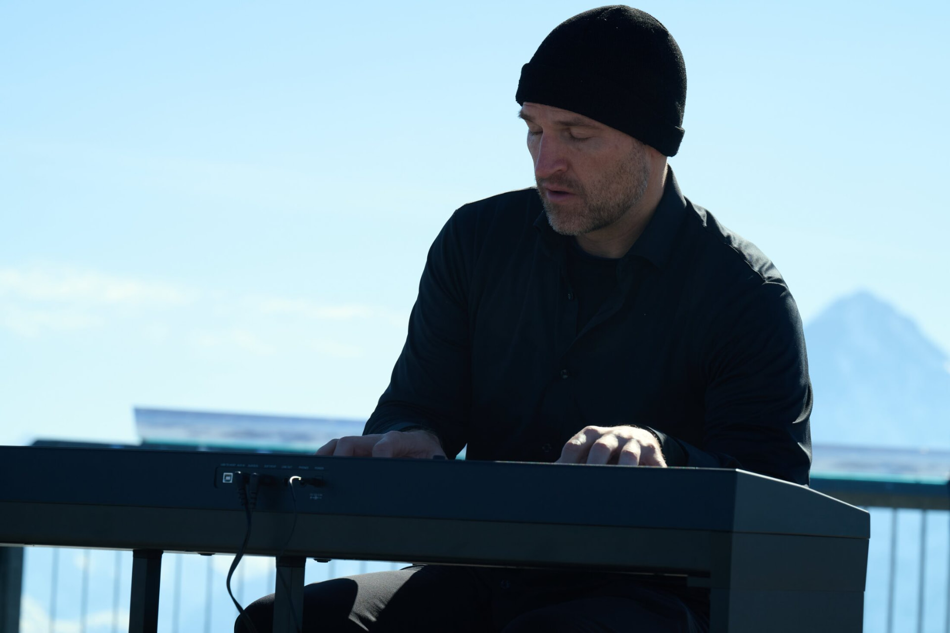 Matthew Mayer at the keys in the alpine light